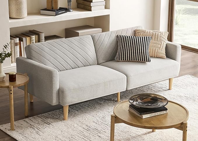 Compact futon sofa in a small, stylish apartment living room